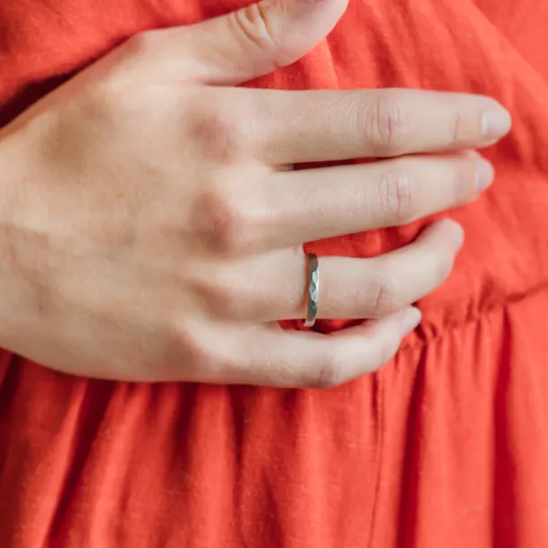 Black wedding bands in gold with hammered surface AZTEK Image