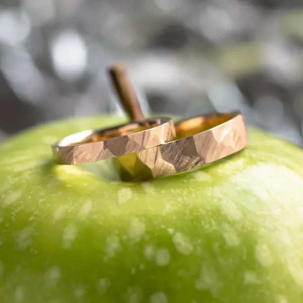 Gold hammered wedding rings BOMM Image