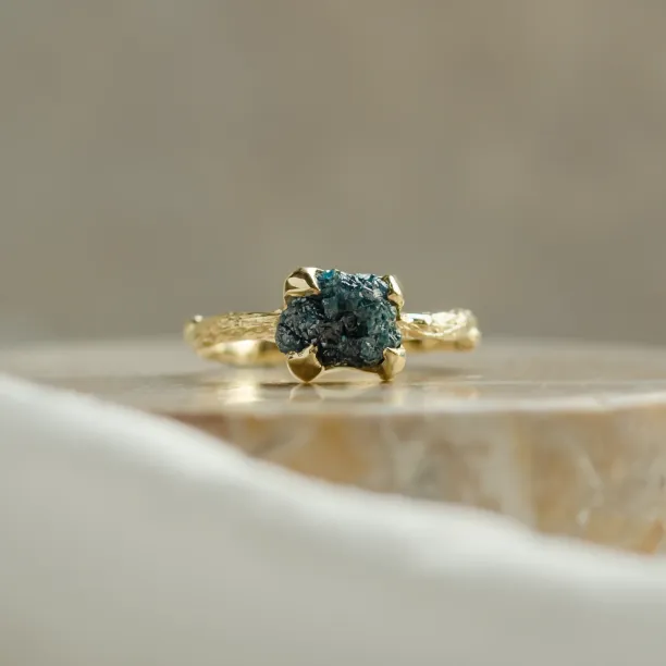 Gold ring with blue raw diamond and unusual rim SKY Image