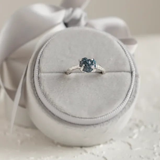 Gold ring with blue raw diamond and unusual rim SKY Image