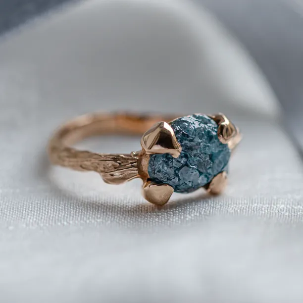 Gold ring with blue raw diamond and unusual rim SKY Image