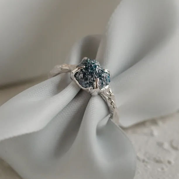 Gold ring with blue raw diamond and unusual rim SKY Image