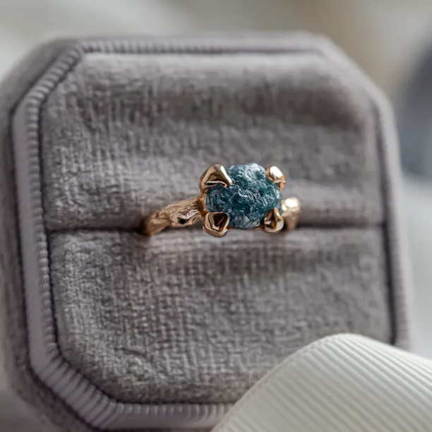 Gold ring with blue raw diamond and unusual rim SKY Image