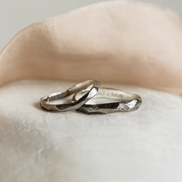 Black hammered wedding bands in organic shape GOLEM Image