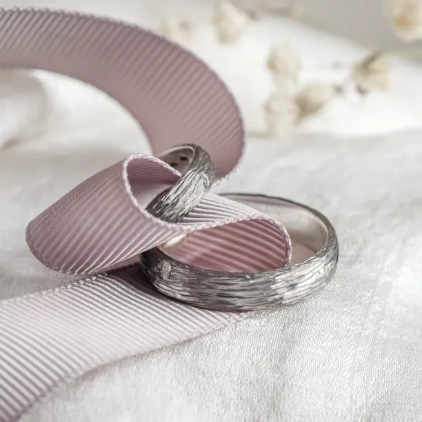 Black wedding rings with woodbark surface EBEN Image