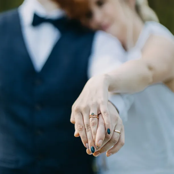 Wavy gold wedding rings with a diamond APRILIA Image