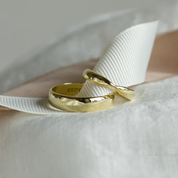 Gold wedding rings with bow tie shape LALI Image