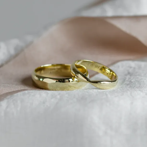 Gold wedding rings with bow tie shape LALI Image