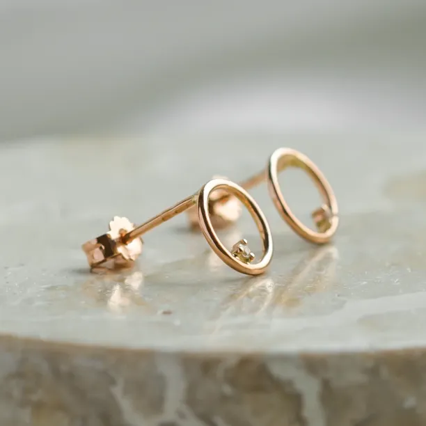 Gold karma earrings with diamonds GARURASANA Image