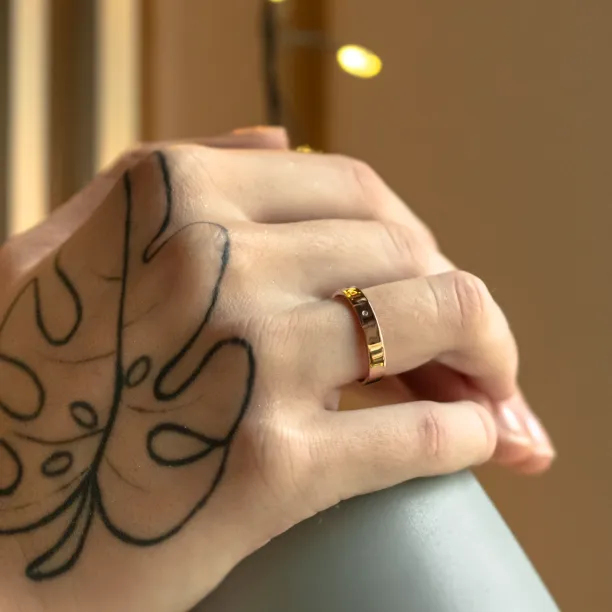Gold wedding rings with engraved trees FORI Image