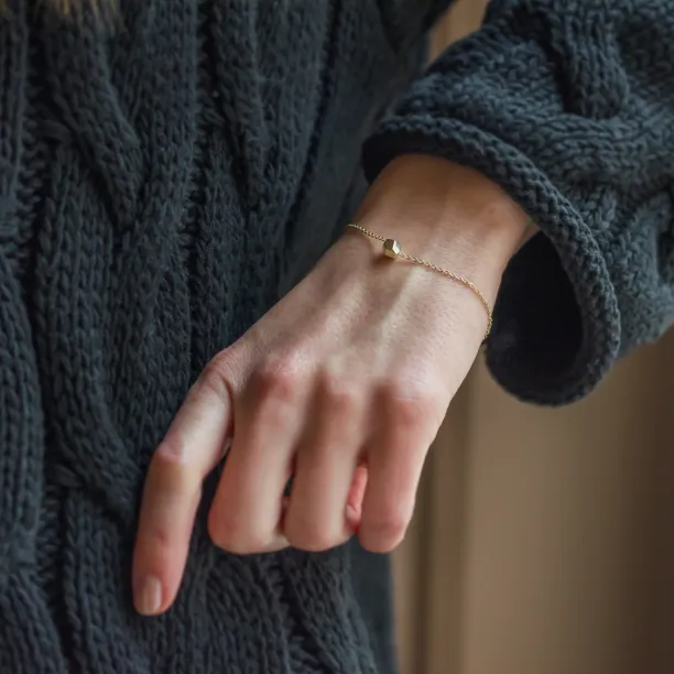 Gold bracelet with a special cube and diamond Gimle Image
