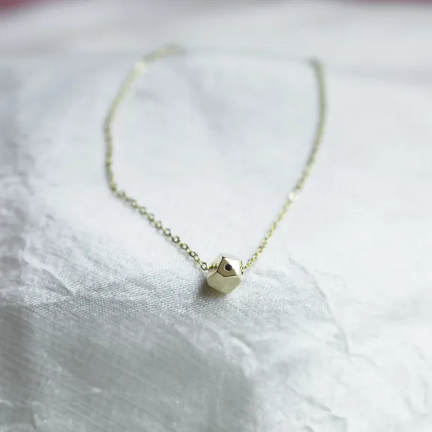 Gold bracelet with a special cube and diamond Gimle Image