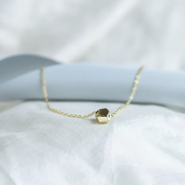 Gold bracelet with a special cube and diamond Gimle Image