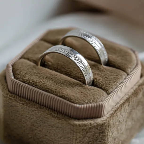 Original wedding rings with relief and diamonds PEACOCK Image