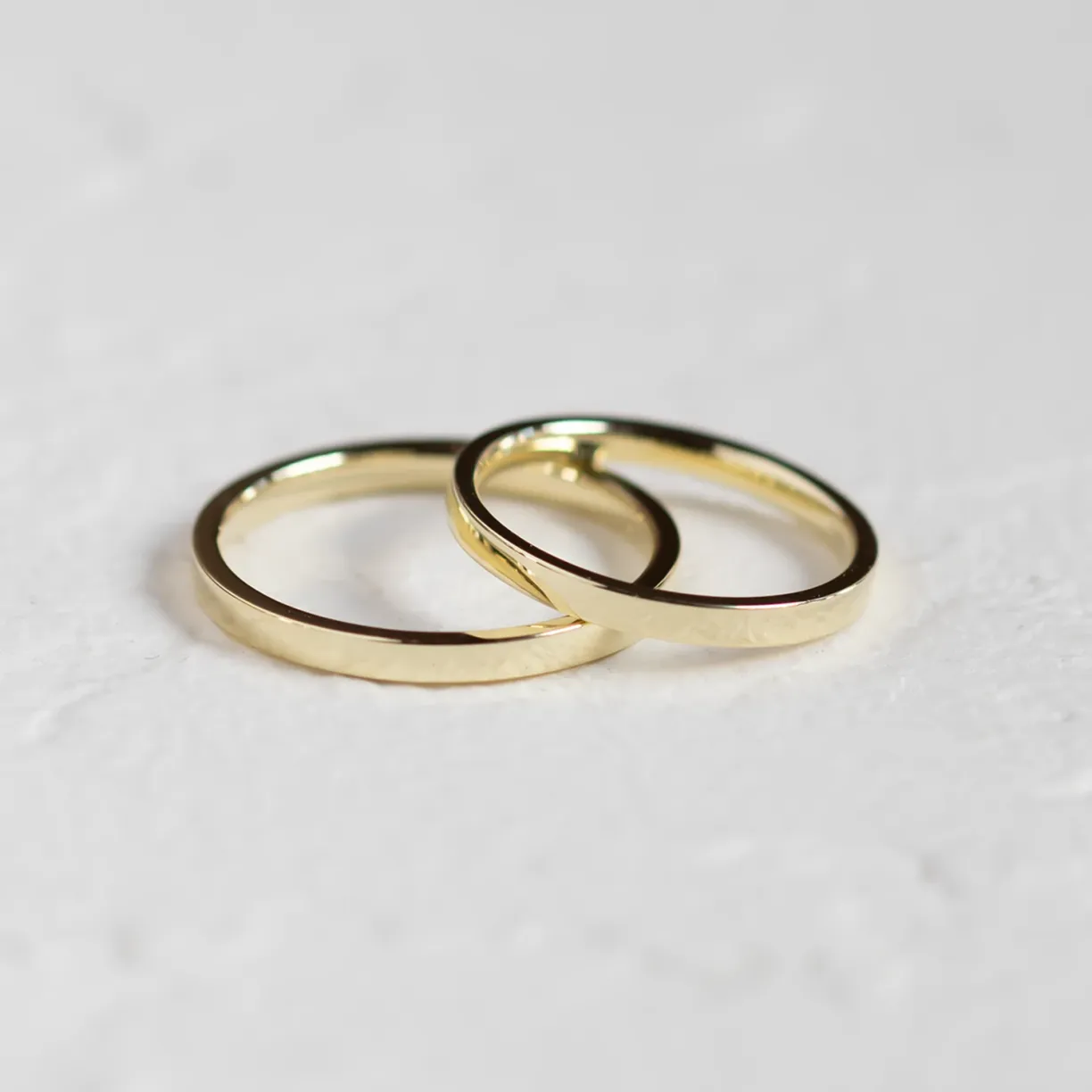 Flat court wedding rings in yellow gold