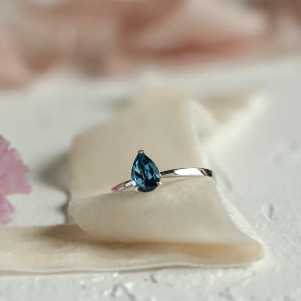 Gold ring with london blue topaz DROP Image