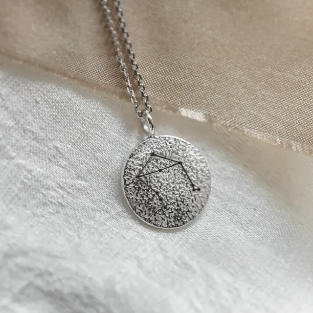 Gold necklace with zodiac sign and unusual surface NALA Image