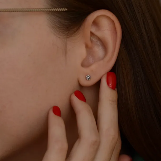 Minimalist gold earrings with salt and pepper diamonds LOLI Image
