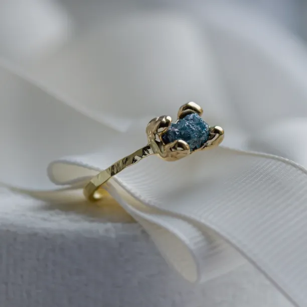 Gold ring with blue raw diamond and hammered surface SEA Image