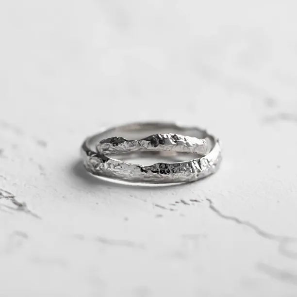 Gold wedding bands with moon surface APOLLO Image