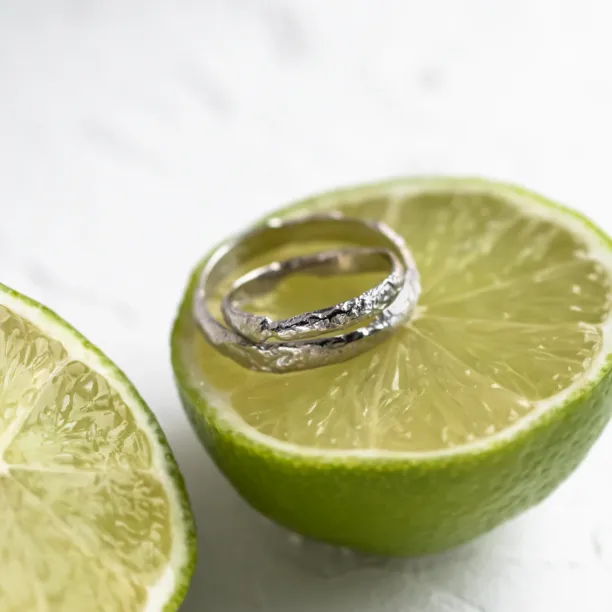 Gold wedding bands with moon surface APOLLO Image