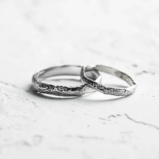 Gold wedding bands with moon surface APOLLO Image