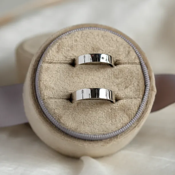 Gold wedding rings with engraved trees FORI Image