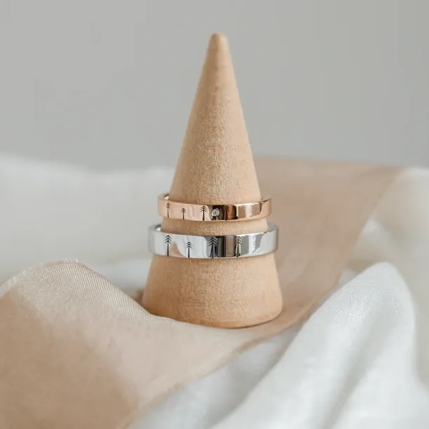 Gold wedding rings with engraved trees FORI Image