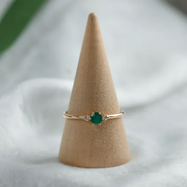 Engagement ring with emerald and side diamonds AVA Image
