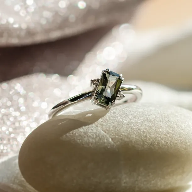 Gold ring with radiant teal sapphire and side diamonds JOY Image