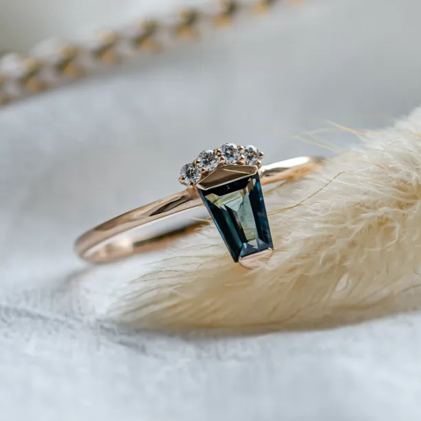 Unusual gold ring with teal sapphire and side diamonds AZRAQ Image