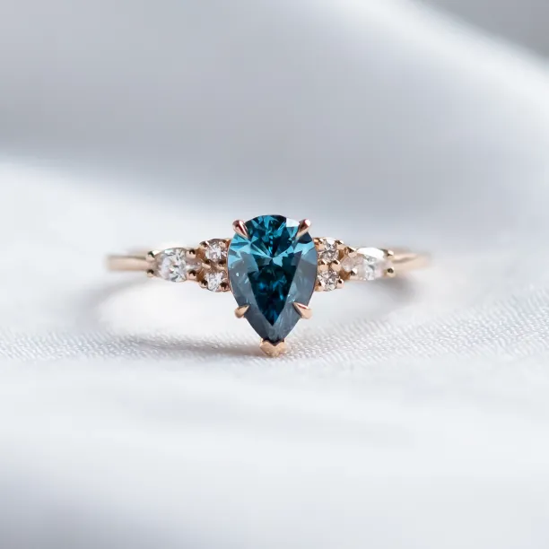Gold ring with pear blue lab grown diamond and side diamonds AZURE Image