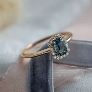 Halo gold ring with teal baguette sapphire and diamonds CELADON Thumbnail