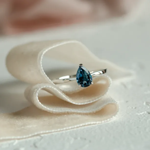 Gold ring with london blue topaz DROP Image