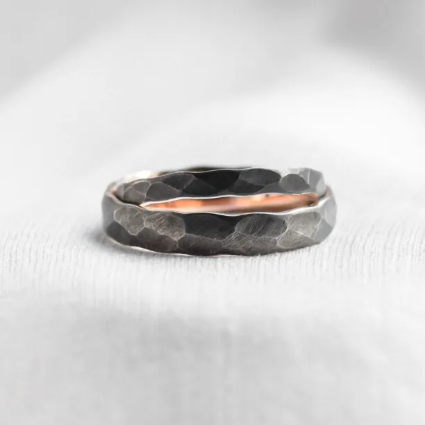 Black wedding bands in gold with hammered surface AZTEK Image