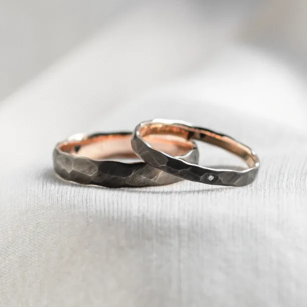 Black wedding bands in gold with hammered surface AZTEK Image