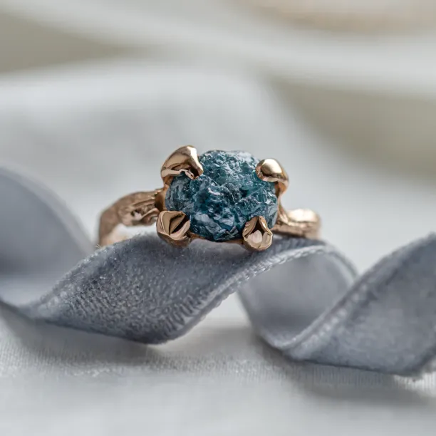 Gold ring with blue raw diamond and unusual rim SKY Image