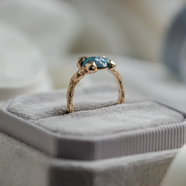 Gold ring with blue raw diamond and unusual rim SKY Image