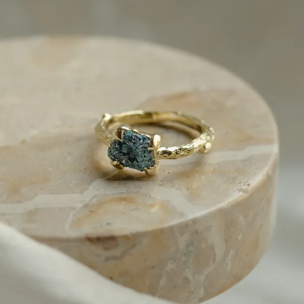 Gold ring with blue raw diamond and unusual rim SKY Image