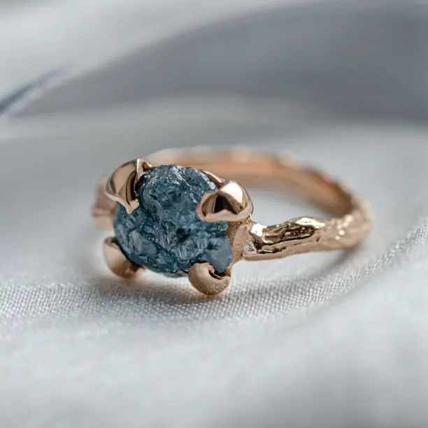 Gold ring with blue raw diamond and unusual rim SKY Image