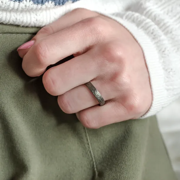 Black wedding rings with woodbark surface EBEN Image