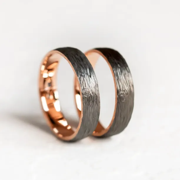 Black wedding rings with woodbark surface EBEN Image