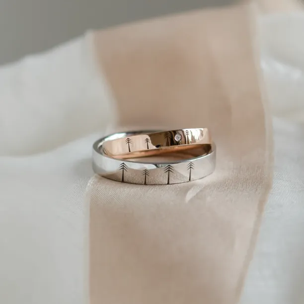 Gold wedding rings with engraved trees FORI Image
