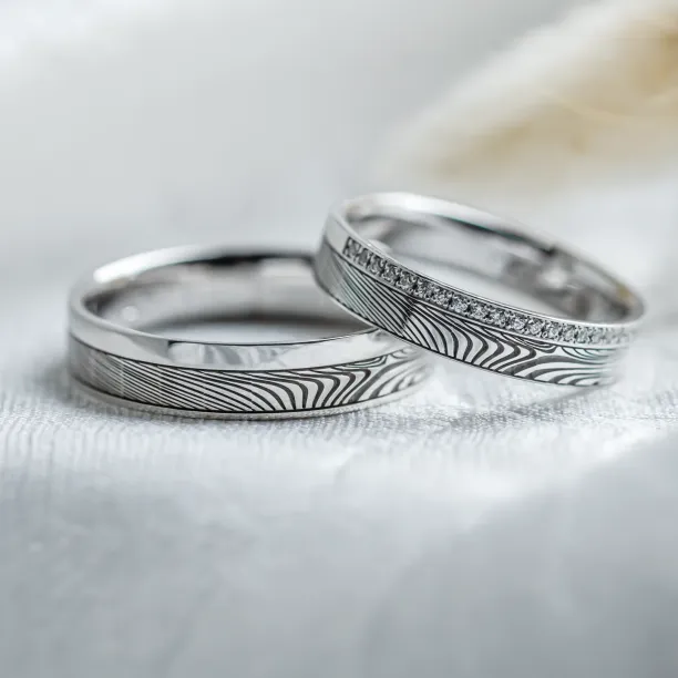 Original wedding rings with relief and diamonds PEACOCK Image
