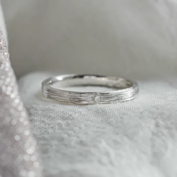 Original wedding ring with tree bark surface NIXON Image