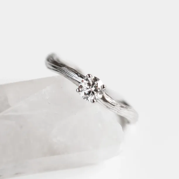 Atypical engagement ring with diamond and tree bark surface RIA Image