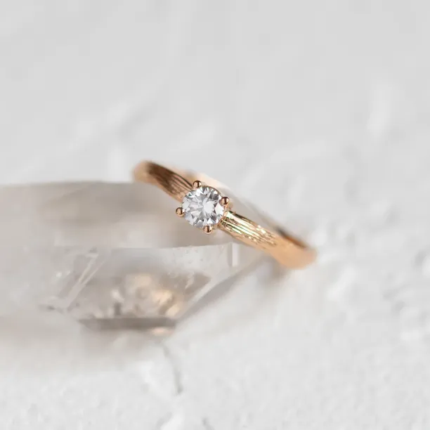 Atypical engagement ring with diamond and tree bark surface RIA Image