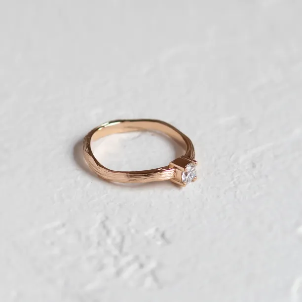 Atypical engagement ring with diamond and tree bark surface RIA Image