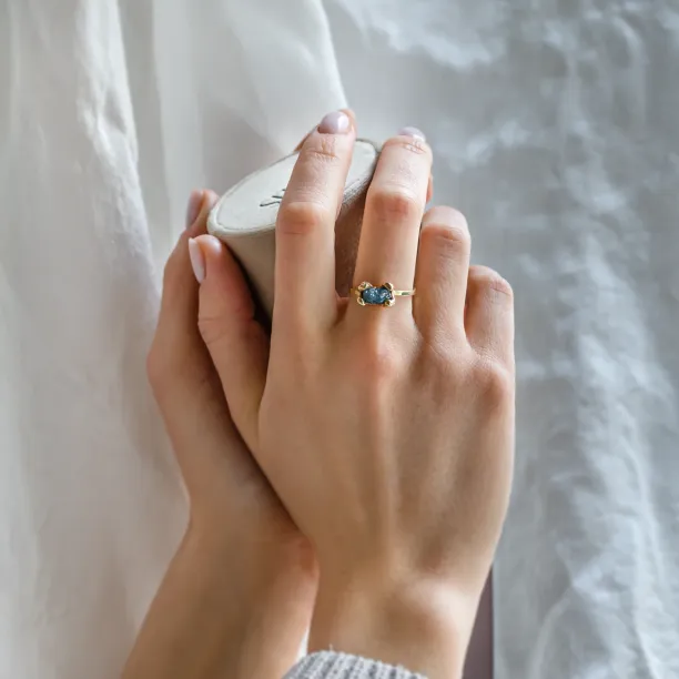 Gold ring with blue raw diamond and hammered surface SEA Image