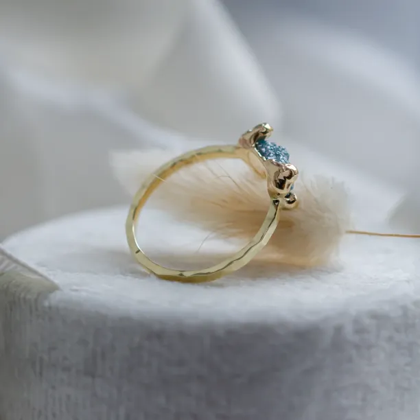 Gold ring with blue raw diamond and hammered surface SEA Image